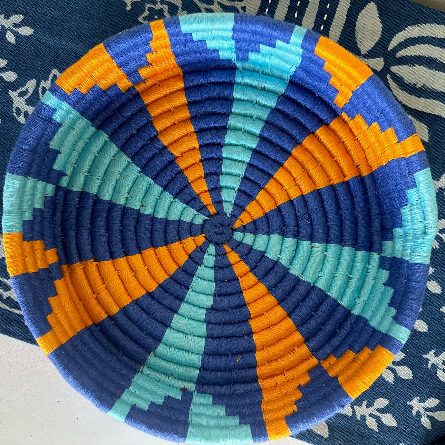 Pin Wheel - Blue and Orangish Yellow Sabai Grass Wall Basket- 10 by 2 inches